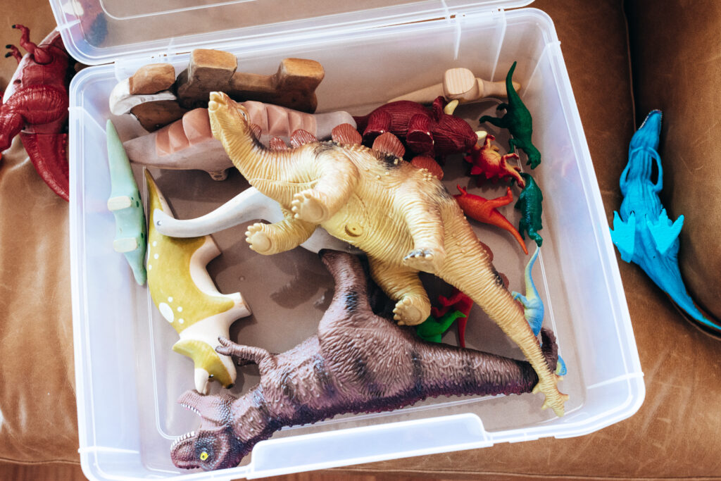 box of kid's dinosaur toys
