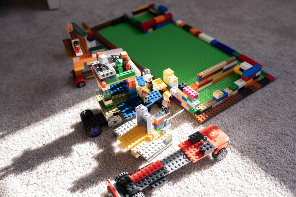 A lego city built by a boy during a documentary family photography session by These Days Photography in Fairfax, VA
